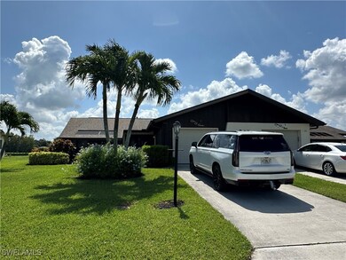 View of property exterior with driveway, an attach