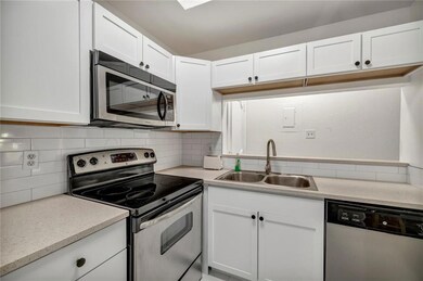 Kitchen with stainless steel appliances, a sink, 