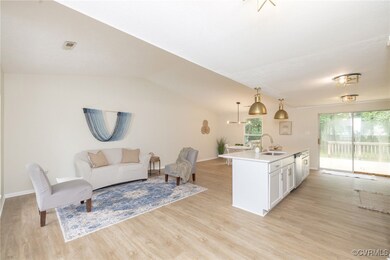 Living area with light wood-style flooring, plenty