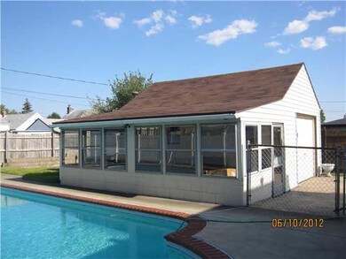 Porch - Enclosed. Covered part of the garage overl