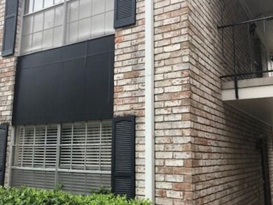 Classic brick architecture with black shutters and
