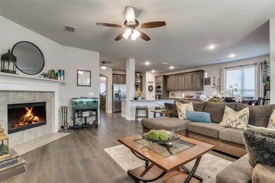 Open living room with wood burning fireplace