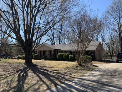 Mature trees in fron and back of property. Great  concrete driveway with plenty of room