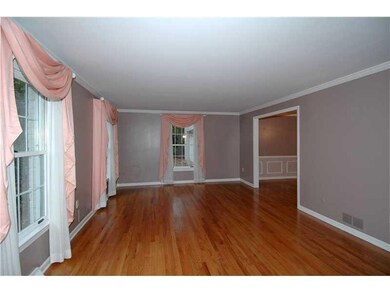 Living Room. The hardwood floor and molding celing