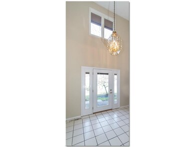 Inviting Two Story Foyer with Ceramic Tile Floorin