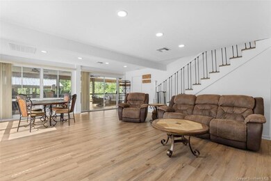 Living/Dining area with windows overlooking exteri