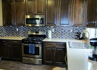 Lovely tile floors are a lovely compliment to cabi