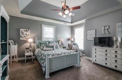 Large, main-level owner's suite has its own bath and nice architectural features. (Photo from previous listing with permission).