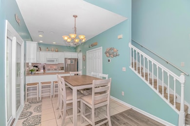 Dining space with stairs, recessed lighting, light