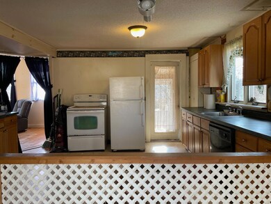 Kitchen with Living Room on left