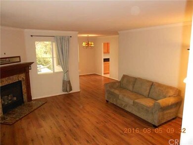 Another view of living room with dining room entra