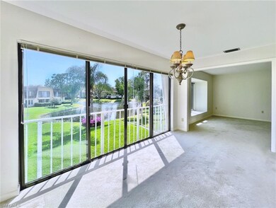 DINING ROOM AND FAMILY ROOM WITH LAKE VIEWS