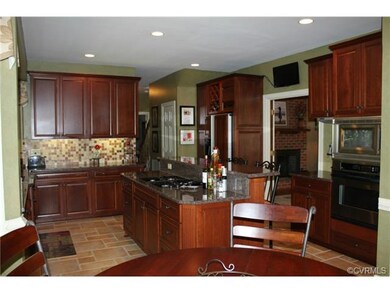 Kitchen - lots of cherry cabinets, granite counter