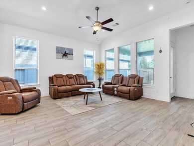 Tall windows in the living room offer beautiful vi