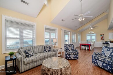 Open living/dining room w/ fireplace