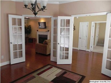 DINING ROOM HAS TWO SETS OF FRENCH DOORS.