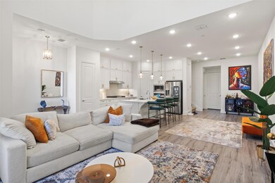 Living room featuring sink, a notable chandelier, 