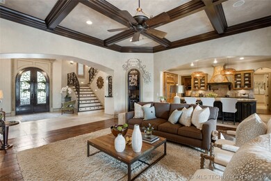 View from great room into foyer and kitchen reveal