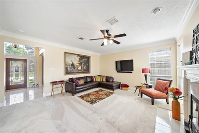 With plenty of options for layout, this light filled area includes three windows, crown moulding, and high ceilings.