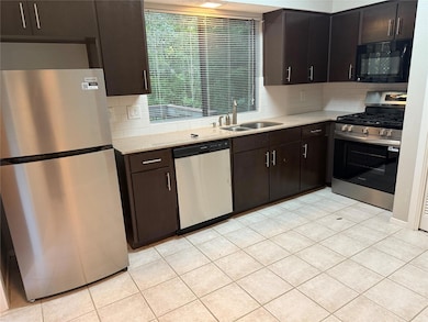 Kitchen featuring stainless steel appliances, a s