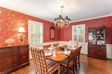 Dining room - Note the custom shutters through the property