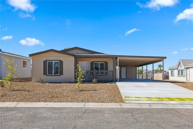 View of front of home featuring a carport