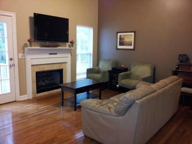 Vaulted family room with a cozy fireplace. Open floor plan makes entertaining easy for a larger group!