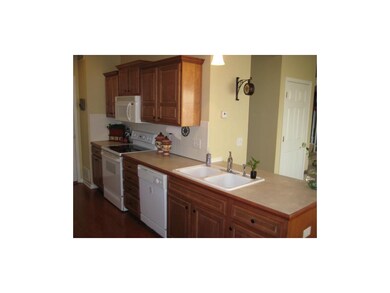 Updated Wood Floors in Galley Style Kitchen