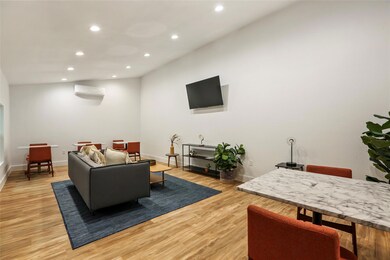 Living area featuring a wall mounted air conditio