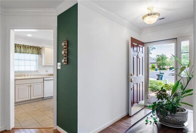 Wood floors, crown moulding, all glass storm door 