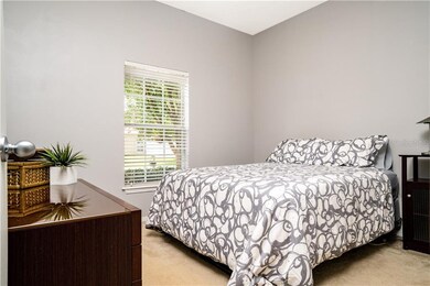 2nd Bedroom with View of Shrub Beds at Front of Ho