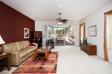 Living room and view out screened patio.