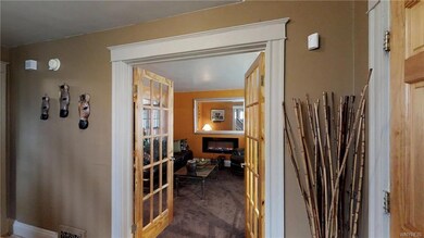 Beautiful oak French doors welcome you into the wa