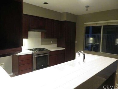The kitchen has beautiful cabinets and stainless s