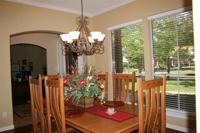 Beautiful Amish dining room with nice view of front yard.