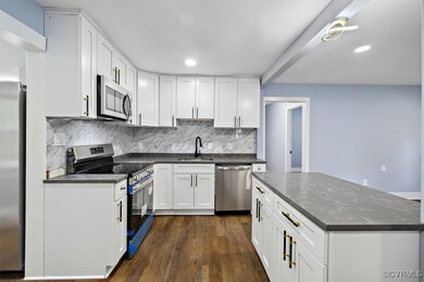 Kitchen featuring sink, backsplash, dark wood-type