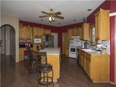 Kitchen features built-in desk and lots of cabinet