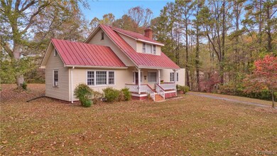 View of front of house with a front lawn and covered porch