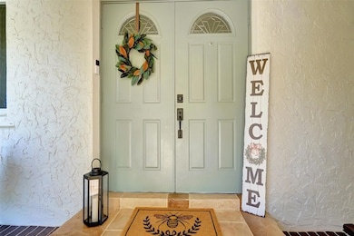 Covered front entrance with double doors