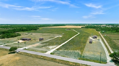 Birds eye view of property with a rural view