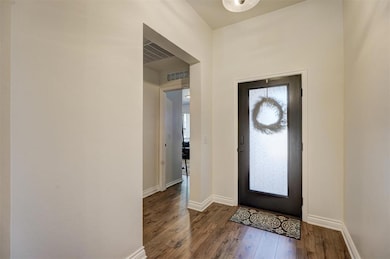 Foyer entrance featuring hardwood / wood-style floors