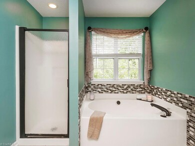Master Bathroom with Separate Shower and Garden tub with tile surround