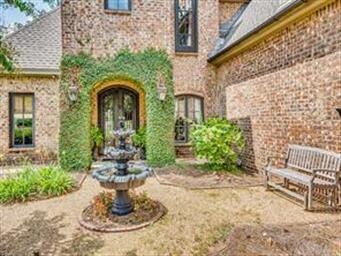 A courtyard with fountain sets the tone for this h