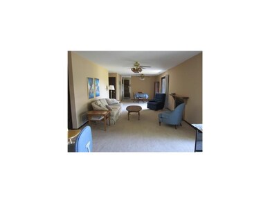 Living Room. With Fireplace.  2 Sets of Sliders to