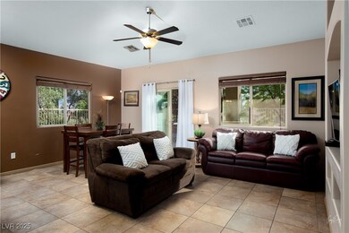 Living room with light tile patterned floors, a ce