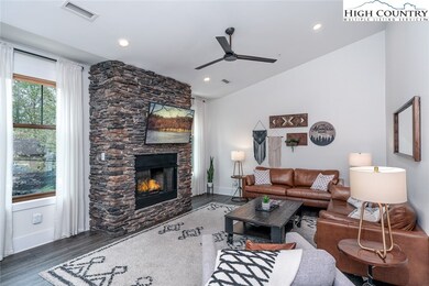 Stacked stone fireplace with large flat-screen TV