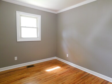 Bedroom 1 has hardwood flooring.