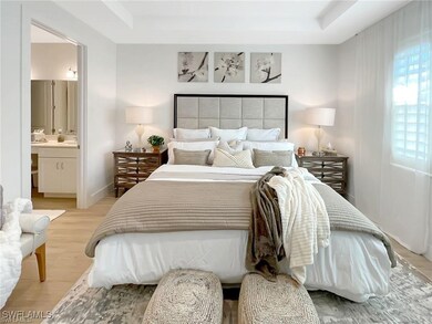 Primary Bedroom with light wood finished floors, a