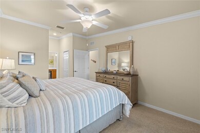 Bedroom featuring crown molding, baseboards, visib
