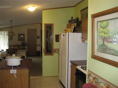Kitchen opens into the dining area.